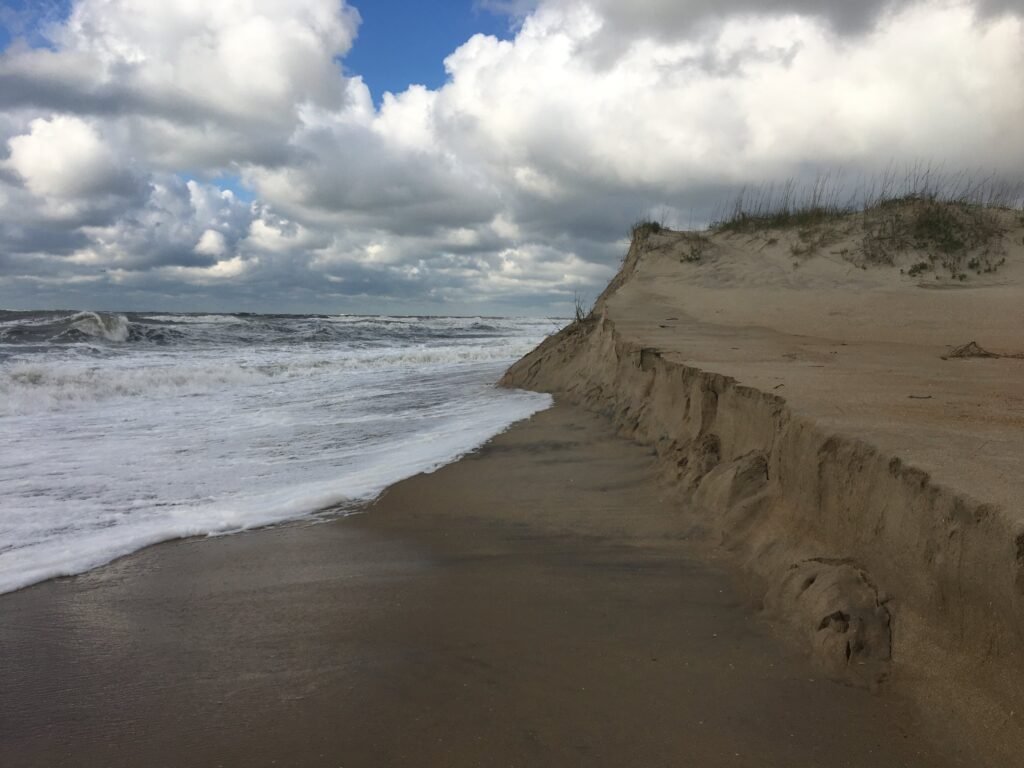 A steep, wave-cut sand scarp along the south-facing beach at Cape Point.