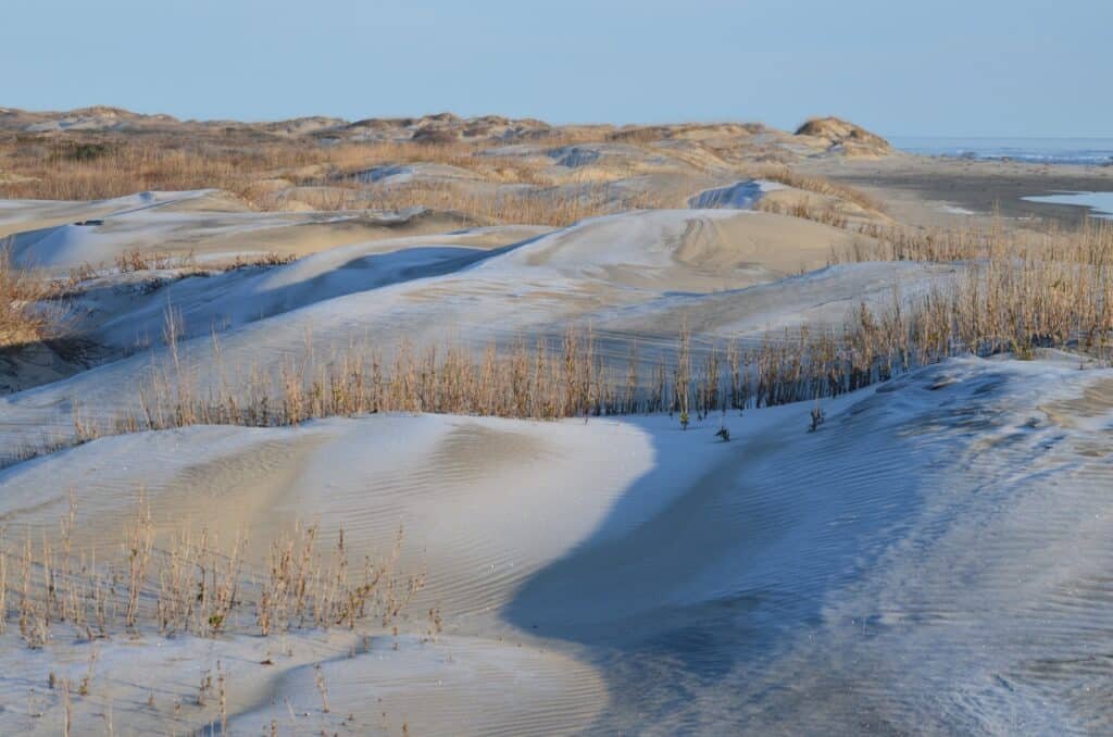 Frost coats the sand and marsh grass on Bodie Spit on a cold, clear Outer Banks morning.