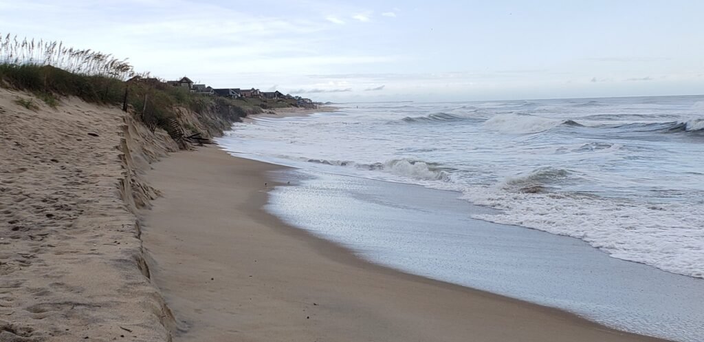 High tide runs up to the base of the dunes south of Ramp 38, leaving almost no dry sand to drive on.
